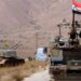Serang Suriah, Israel Targetkan Radar Militer 2 Sebuah kendaraan militer mengibarkan bendera Suriah dan Hezbollah di Kota Qalamoun, Suriah.