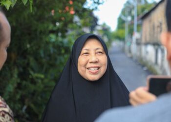Salah satu warga Gang Rahmat, Lingkungan 5, Kelurahan Sitirejo II, Kecamatan Medan Amplas.